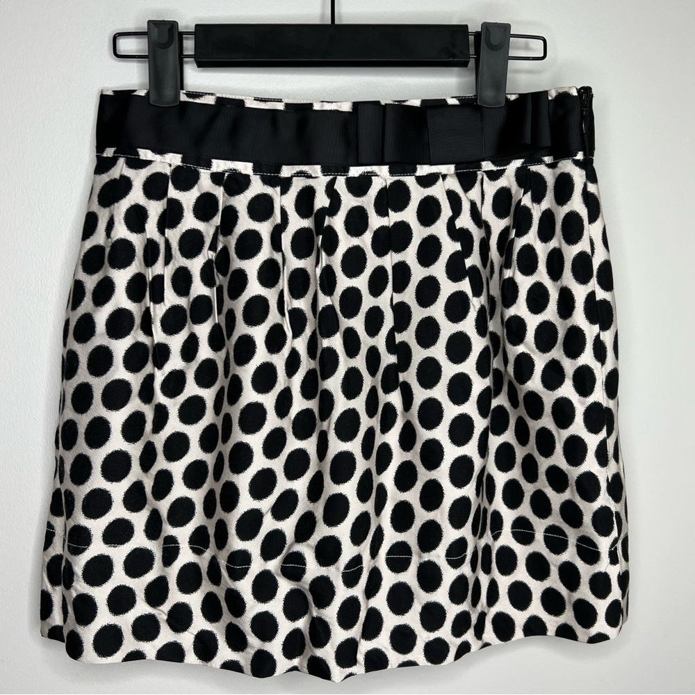 Forever 21 black polka dot mini skirt. Bow accent. Size zip. Size small.